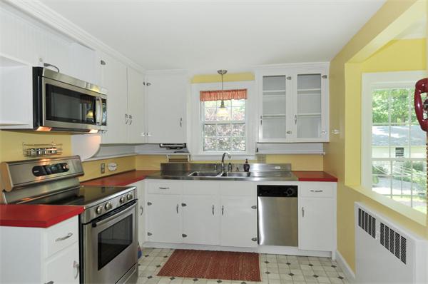 727 Fowler Road Northbridge, MA 01534 - Photo 4 of 23 a kitchen with stainless steel appliances a stove sink microwave and cabinets