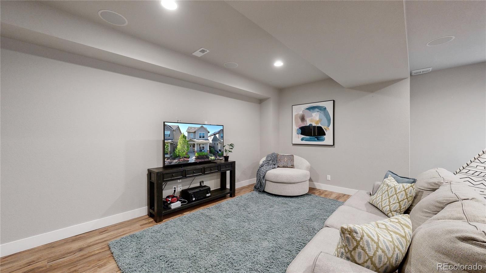 8728 54th Place Denver, CO 80238 - Photo 21 of 35 a living room with furniture and a window