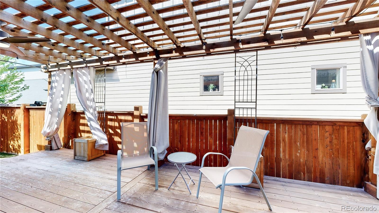8728 54th Place Denver, CO 80238 - Photo 26 of 35 a view of a chair and tables in the patio