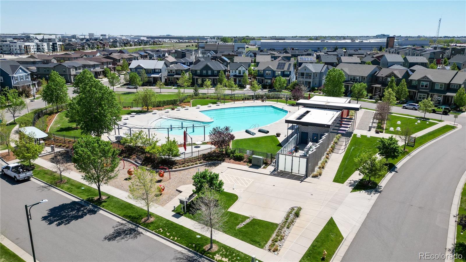 8728 54th Place Denver, CO 80238 - Photo 4 of 35 an aerial view of a house with a garden and lake view