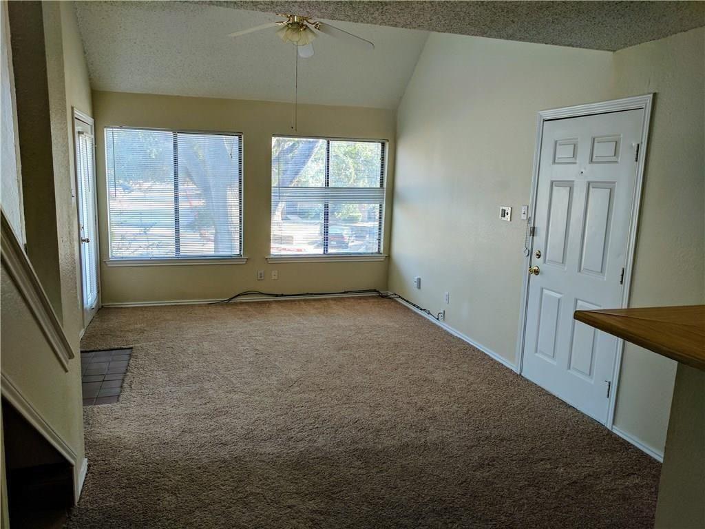 9803 Walnut Street, Unit 212 Dallas, TX 75243 - Photo 2 of 10 an empty room with windows