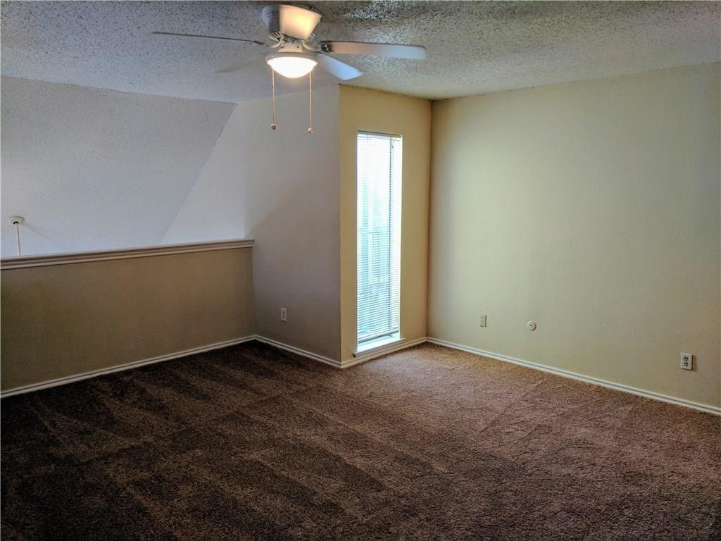 9803 Walnut Street, Unit 212 Dallas, TX 75243 - Photo 7 of 10 an empty room with a bathroom