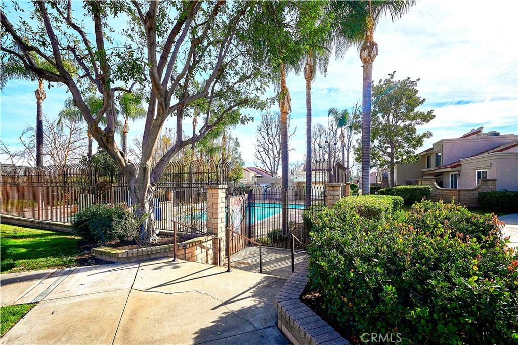 6949 Laguna Place, Unit B1 Rancho Cucamonga, CA 91701 - Photo 16 of 20 a house with trees in front of it