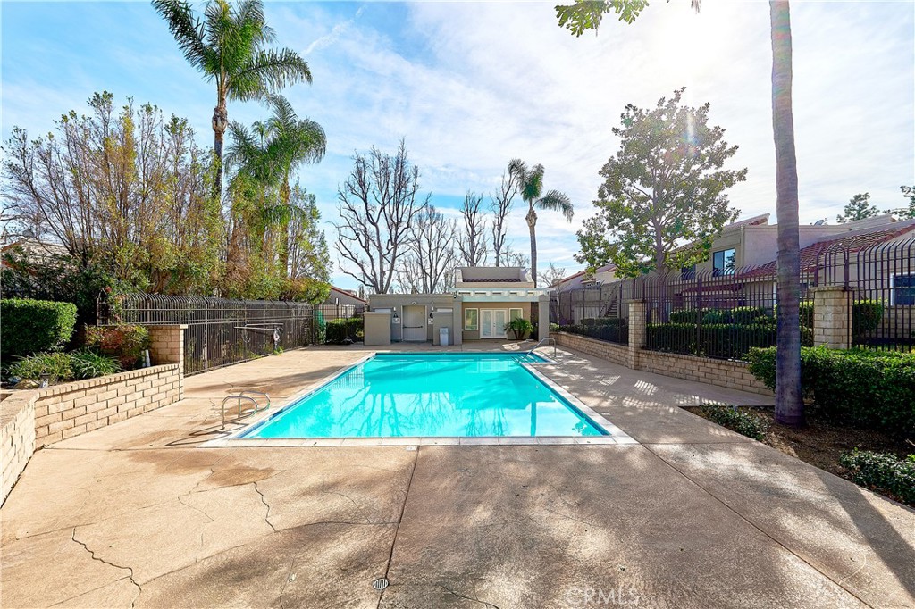 6949 Laguna Place, Unit B1 Rancho Cucamonga, CA 91701 - Photo 17 of 20 a small garden with trees in front of it
