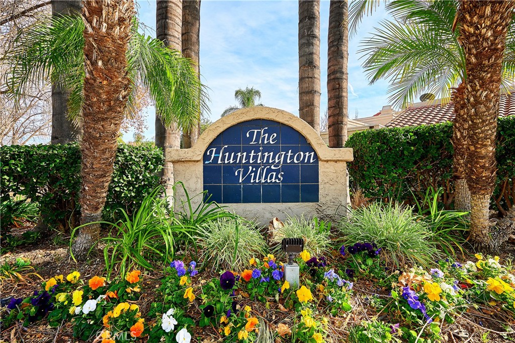 6949 Laguna Place, Unit B1 Rancho Cucamonga, CA 91701 - Photo 3 of 20 a sign that is sitting in front of flowers