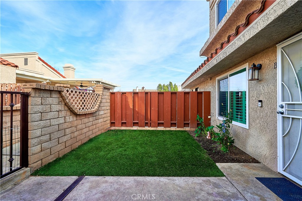 6949 Laguna Place, Unit B1 Rancho Cucamonga, CA 91701 - Photo 10 of 20 a view of a backyard with garden