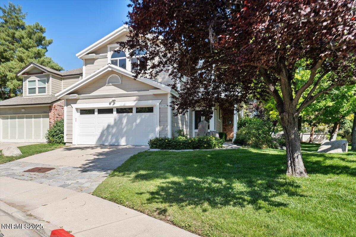 7187 Blue Falls Circle Reno, NV 89511 - Photo 1 of 42 a front view of a house with a yard