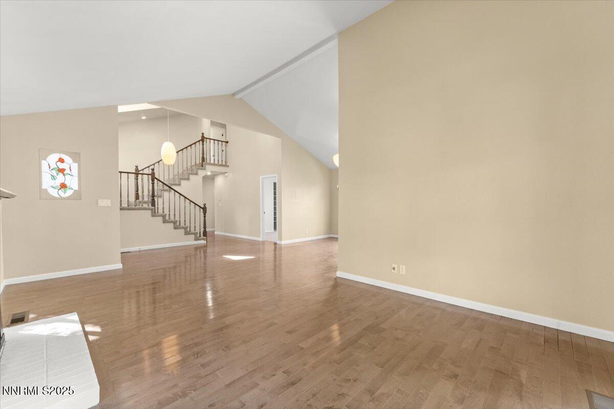 7187 Blue Falls Circle Reno, NV 89511 - Photo 12 of 42 a view of a hallway with wooden floor