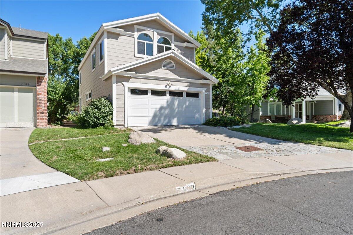 7187 Blue Falls Circle Reno, NV 89511 - Photo 2 of 42 a front view of house with yard and green space