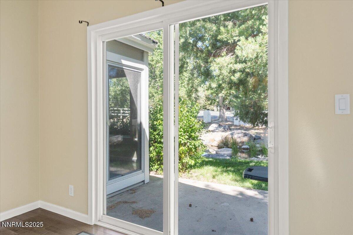 7187 Blue Falls Circle Reno, NV 89511 - Photo 21 of 42 a view of a glass door and a window