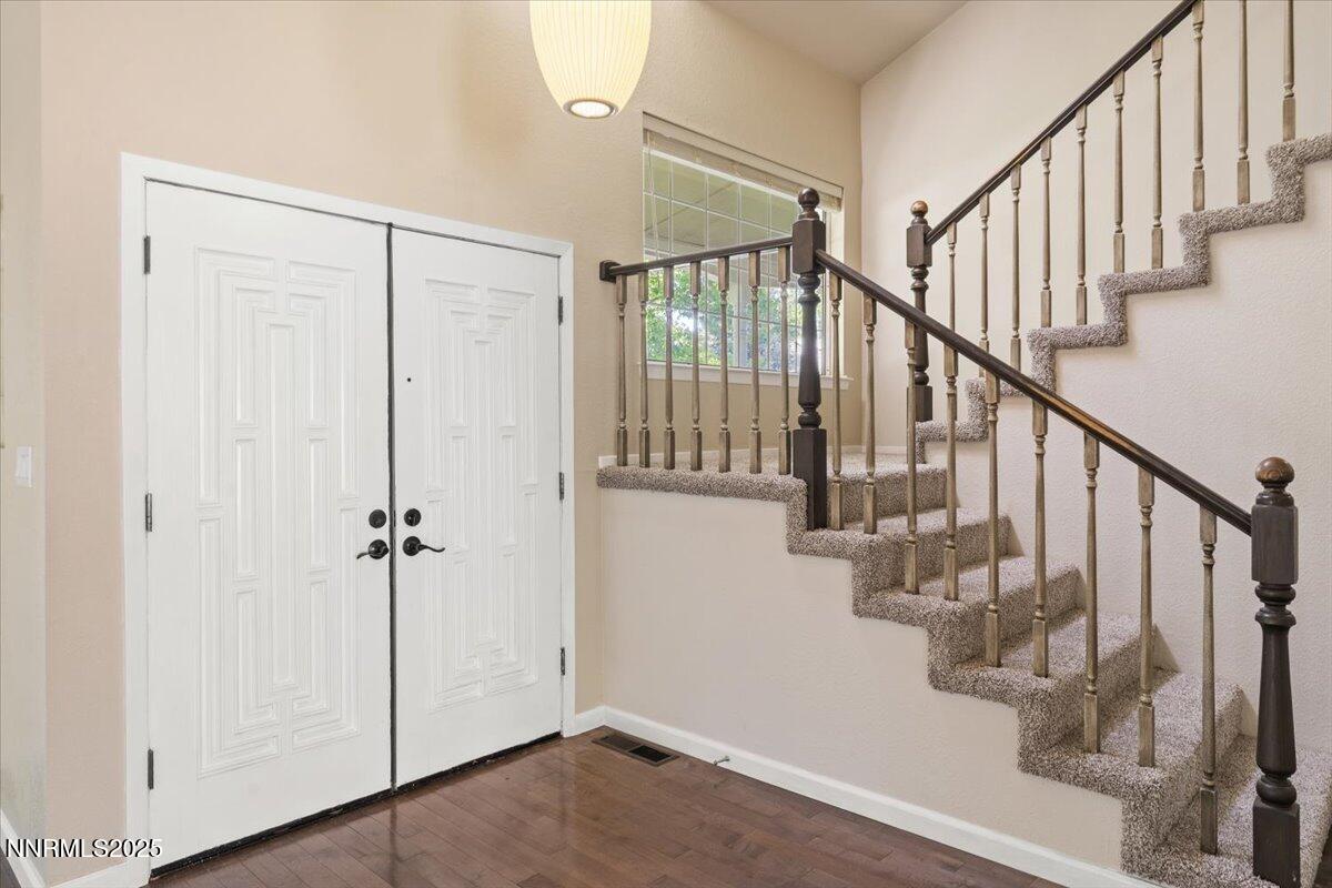 7187 Blue Falls Circle Reno, NV 89511 - Photo 22 of 42 a view of entryway with wooden floor and stairs
