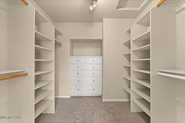 a view of an empty walk in closet