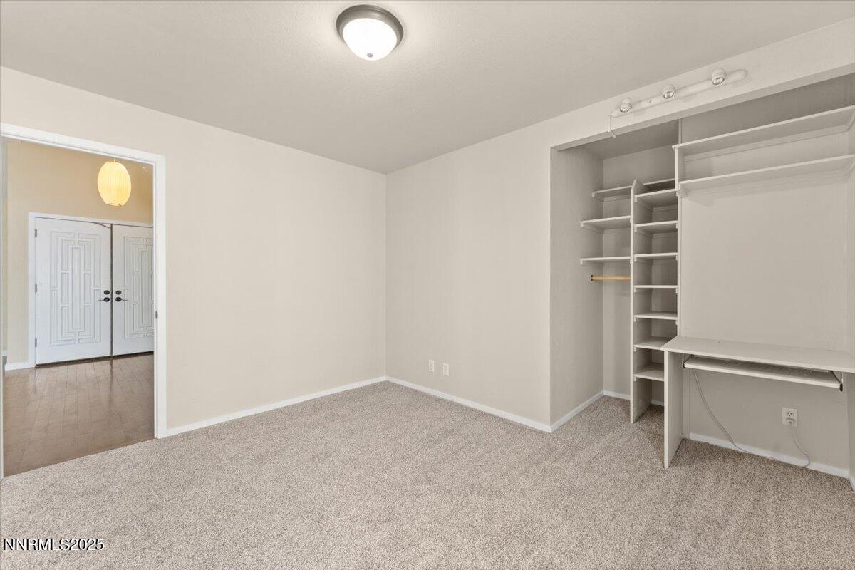 7187 Blue Falls Circle Reno, NV 89511 - Photo 32 of 42 an empty room with closet and windows