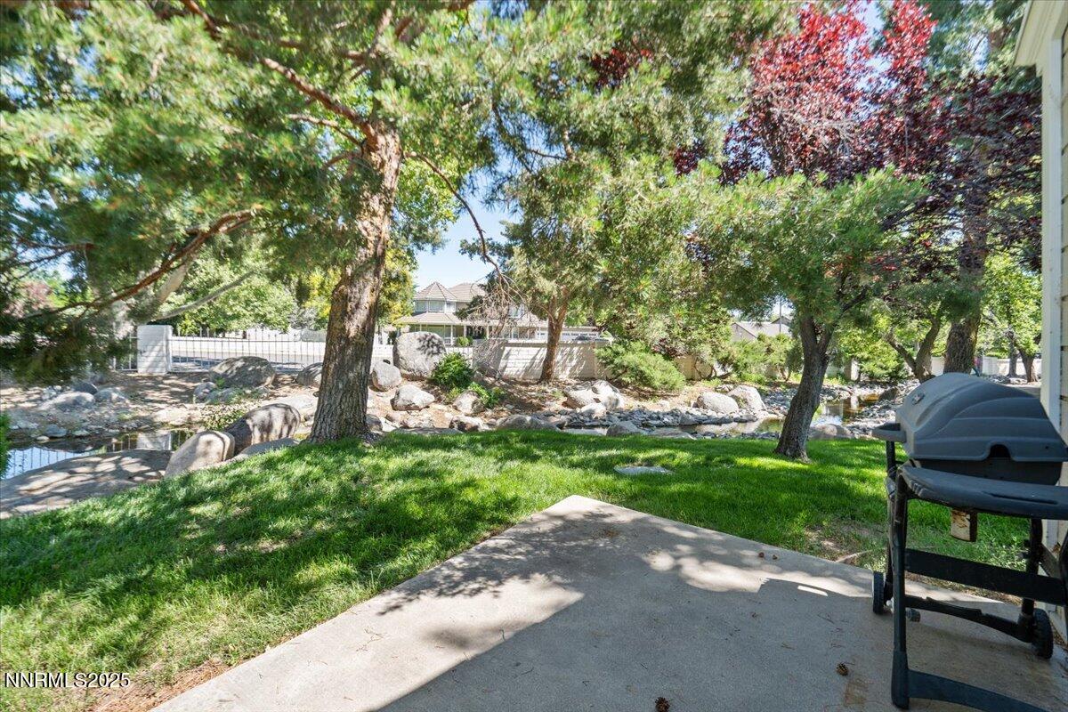 7187 Blue Falls Circle Reno, NV 89511 - Photo 40 of 42 a view of backyard with outdoor seating and green space