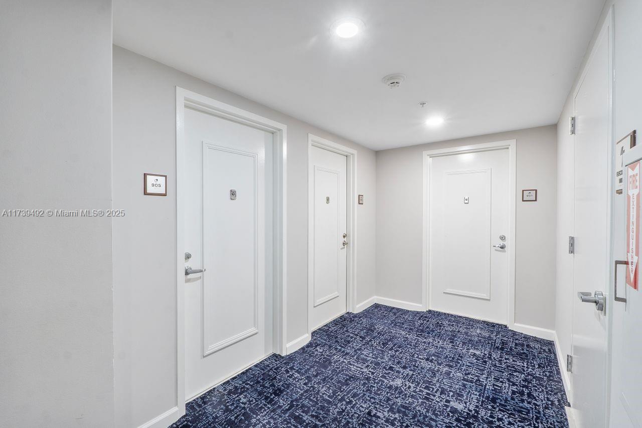 9055 Southwest 73rd Court, Unit 903 Miami, FL 33156 - Photo 15 of 24 a view of a bedroom