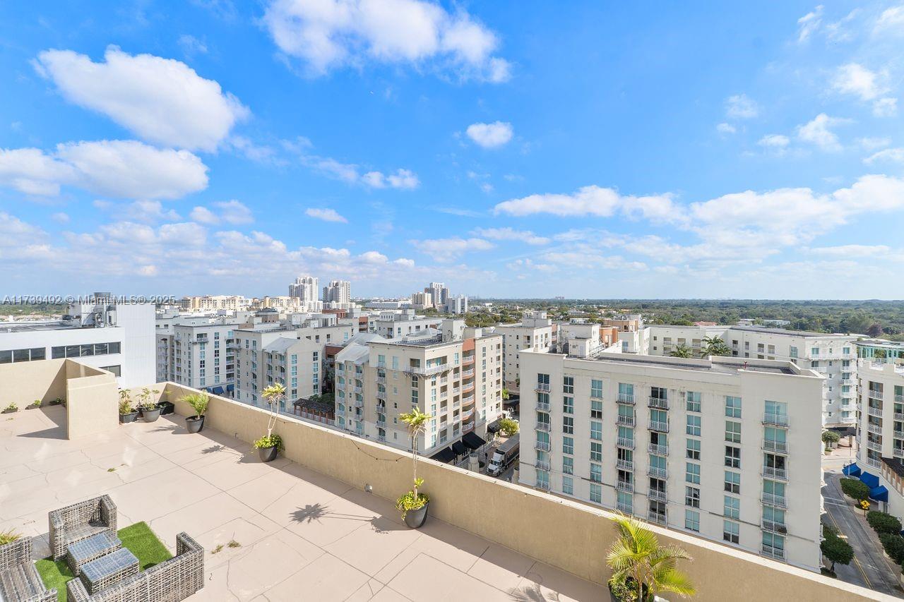 9055 Southwest 73rd Court, Unit 903 Miami, FL 33156 - Photo 22 of 24 a view of a balcony with city view
