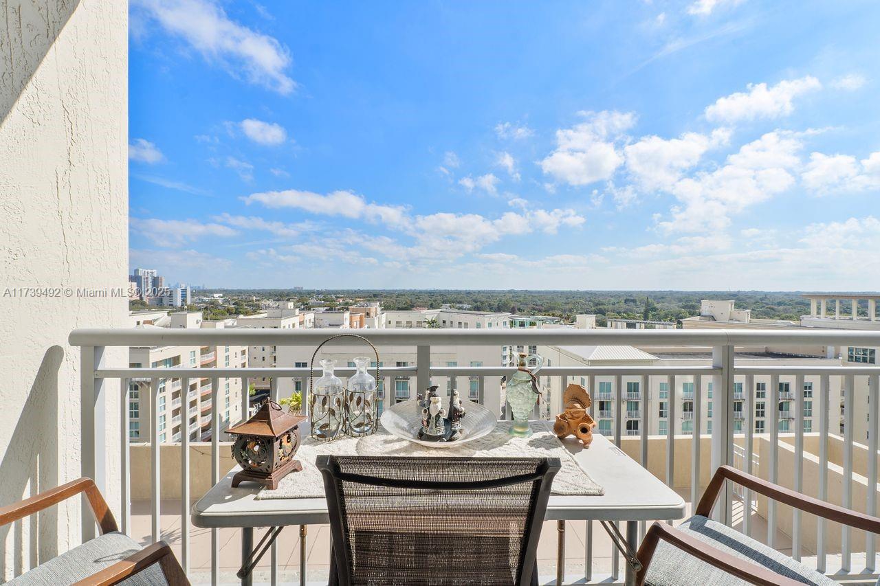 9055 Southwest 73rd Court, Unit 903 Miami, FL 33156 - Photo 5 of 24 a view of a balcony with lake view and mountain view