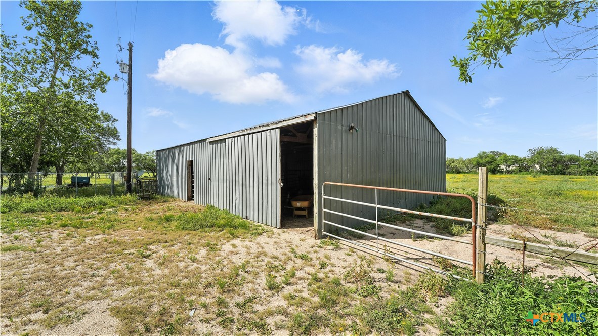 275-279 Cross Road Kingsbury, TX 78638 - Photo 11 of 36 a backyard of a house with lots of green space and mountain view in the back