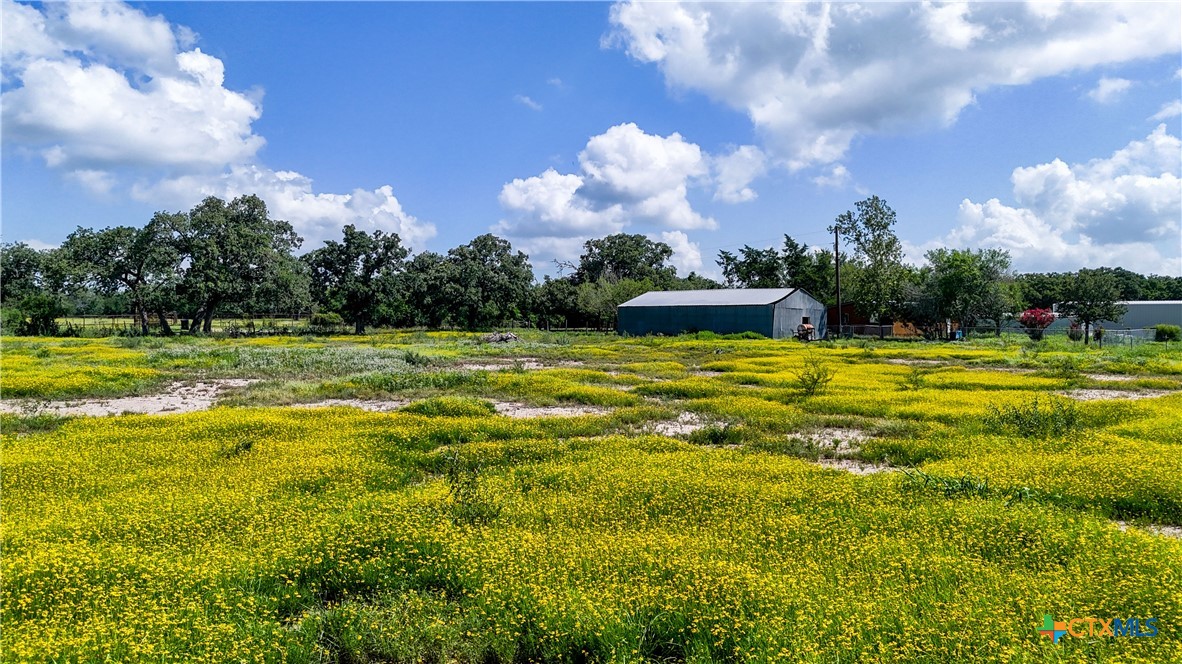 275-279 Cross Road Kingsbury, TX 78638 - Photo 15 of 36 a view of a swimming pool with an outdoor space and seating in back