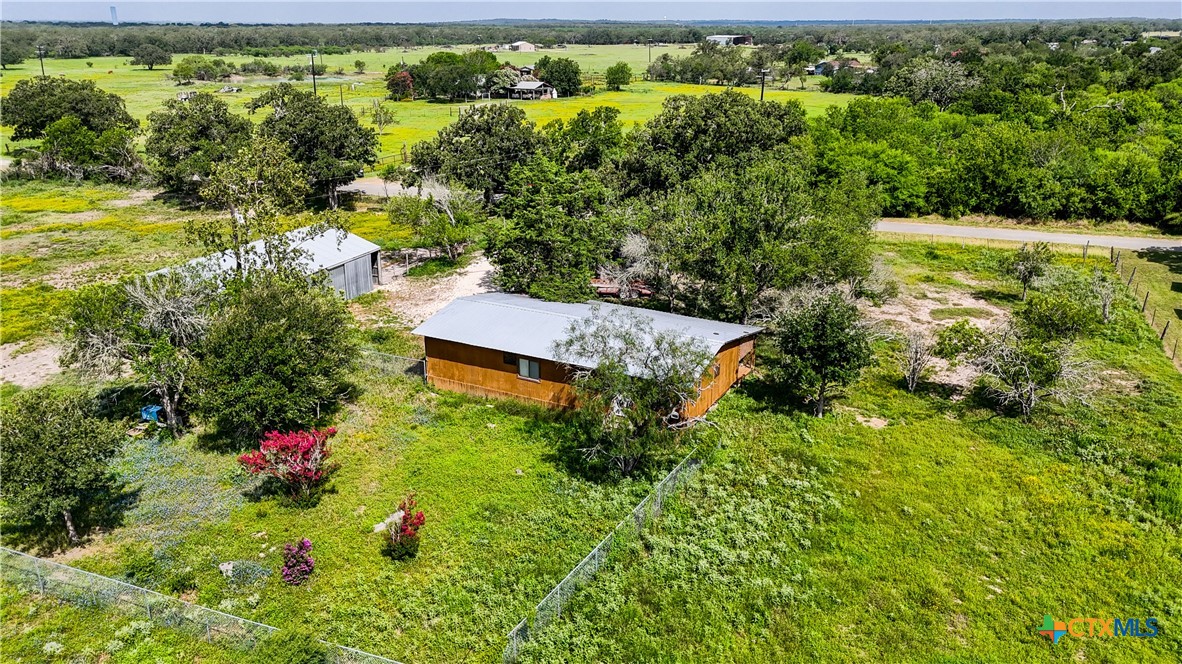 275-279 Cross Road Kingsbury, TX 78638 - Photo 20 of 36 an aerial view of residential house with outdoor space and trees all around