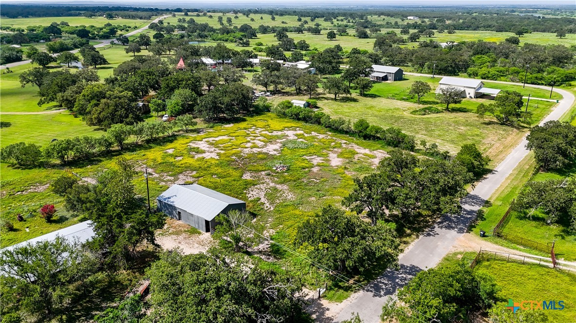 275-279 Cross Road Kingsbury, TX 78638 - Photo 32 of 36 an aerial view of residential houses with outdoor space and street view