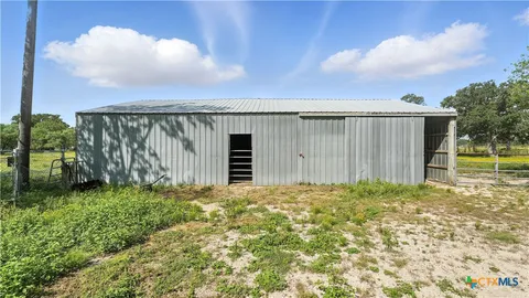 a view of a backyard with pathway