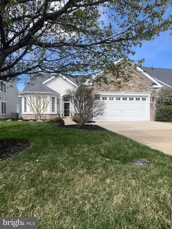 a view of house with yard