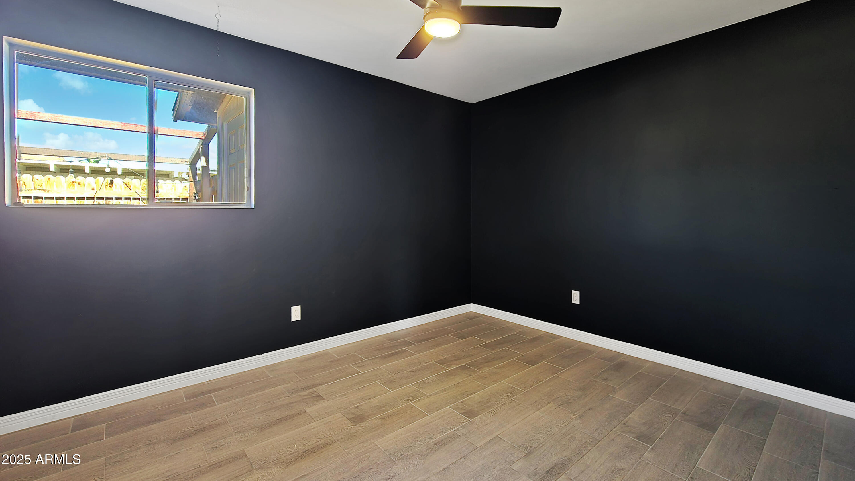 6739 North 16th Street, Unit 14 Phoenix, AZ 85016 - Photo 11 of 19 a view of an empty room with a window