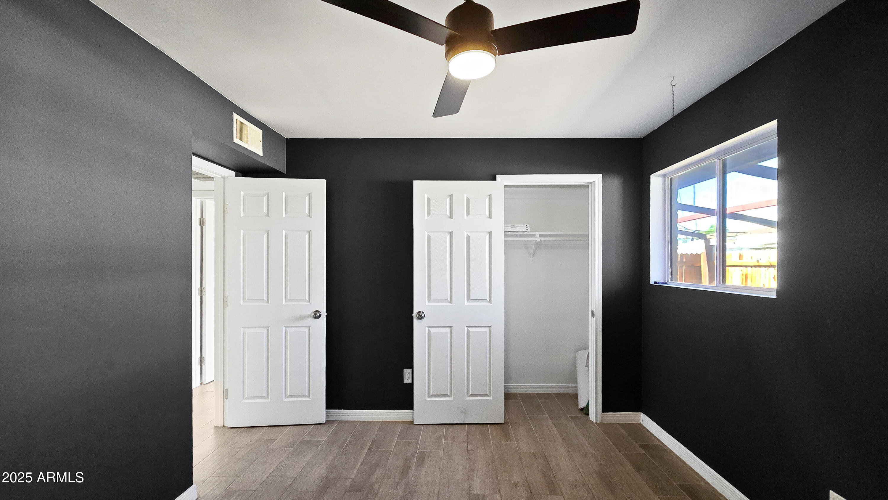 6739 North 16th Street, Unit 14 Phoenix, AZ 85016 - Photo 13 of 19 wooden floor in an empty room with a window