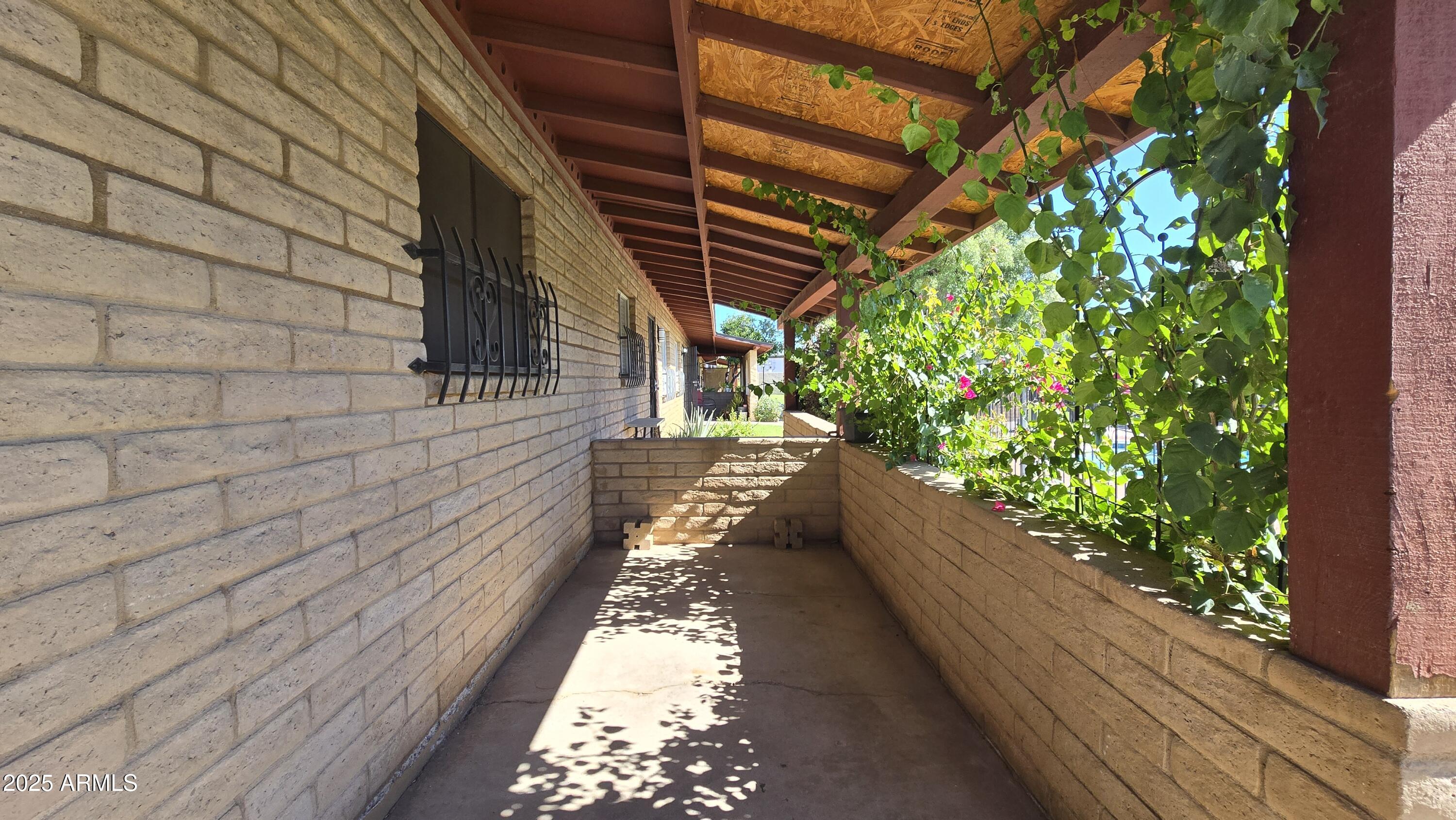6739 North 16th Street, Unit 14 Phoenix, AZ 85016 - Photo 2 of 19 a view of balcony with wooden floor