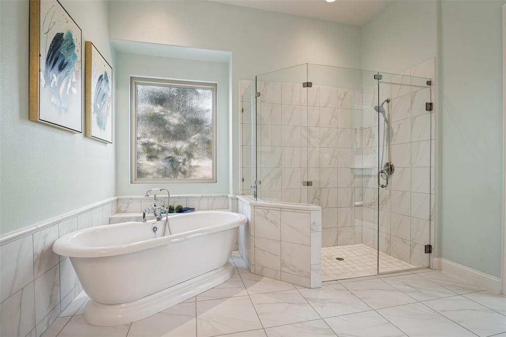 388 Bethany Road Sunnyvale, TX 75182 - Photo 19 of 40 Spacious bathroom featuring a freestanding soaking tub with chrome fixtures, a large glass-enclosed shower, and extensive tile flooring