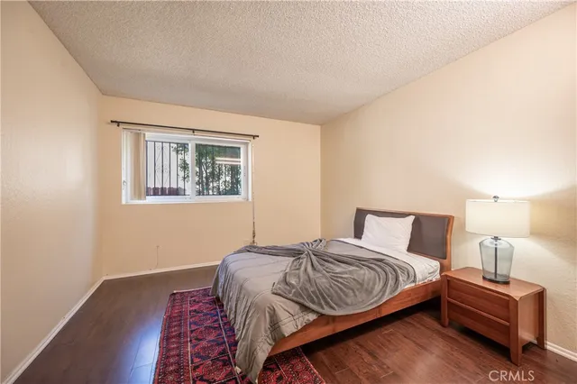 a living room with furniture a table and a potted plant