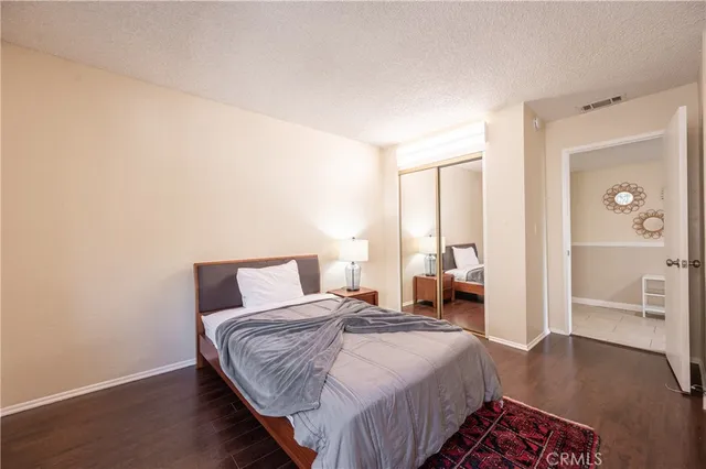 a living room with a couch and a stove top oven