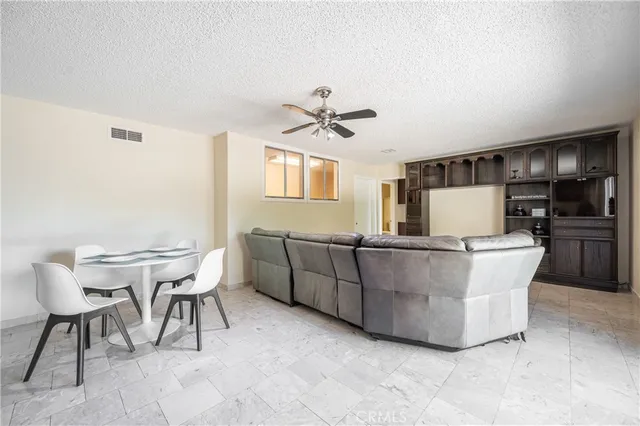 a view of a room with wooden floor and a window