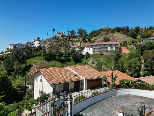 an aerial view of residential house with outdoor space
