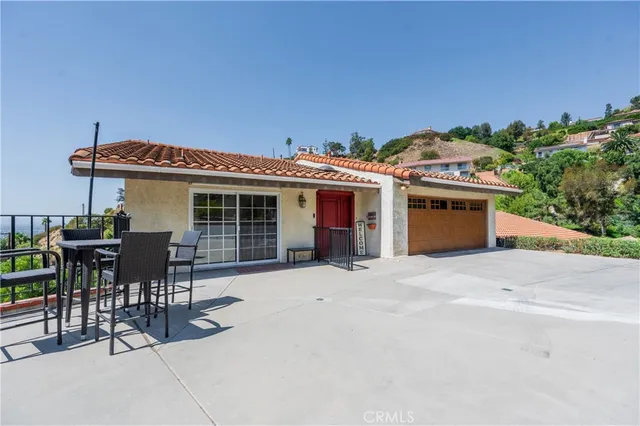 a front view of house with yard outdoor seating and barbeque oven