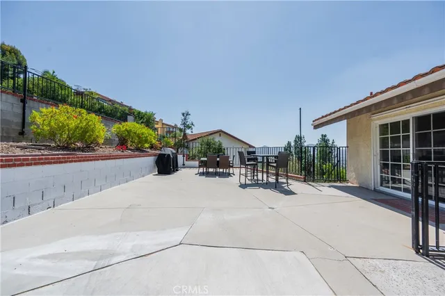 a view of a porch with wooden floor and fence