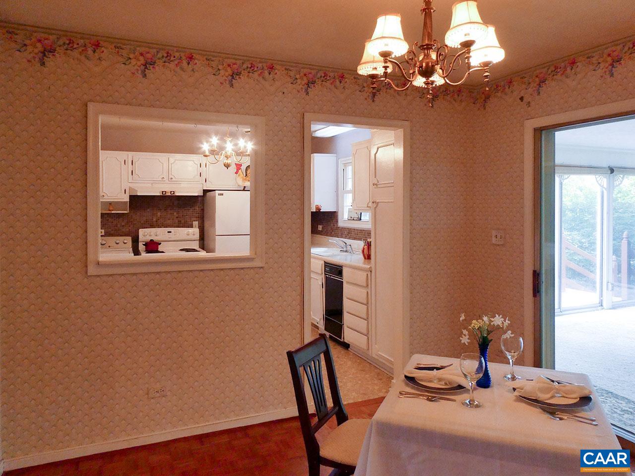 708 Shamrock Road Charlottesville, VA 22903 - Photo 8 of 22 a view of a dining room with furniture and chandelier
