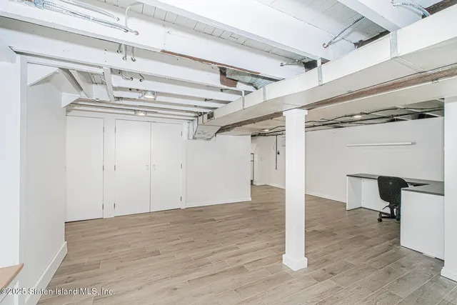 a view of a room with wooden walls