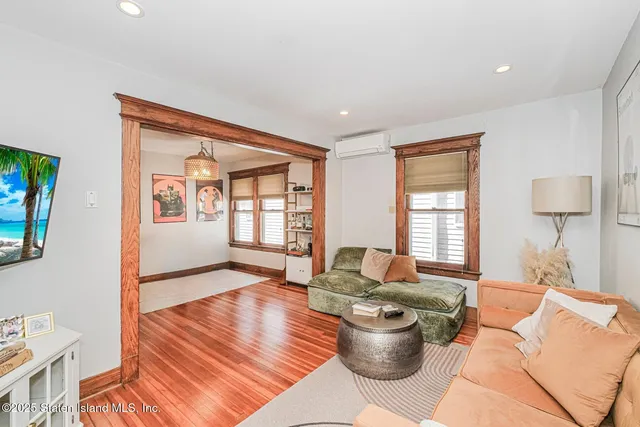 a living room with furniture and a window