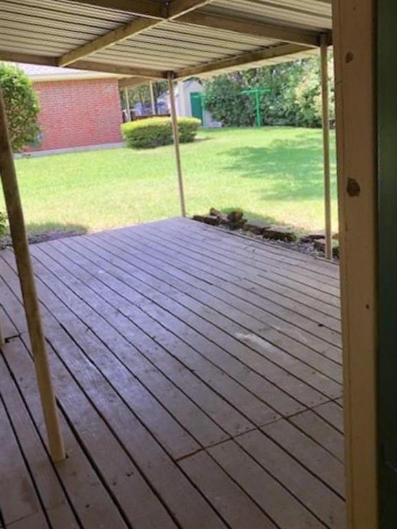 602 West 3rd Street Justin, TX 76247 - Photo 20 of 22 Covered outdoor deck with wood flooring and a metal roof