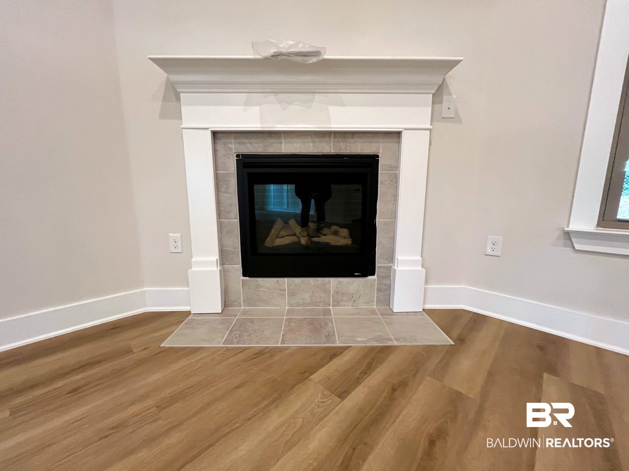 330 Barndling Street Fairhope, AL 36532 - Photo 10 of 31 Details with wood-type flooring and a tile fireplace