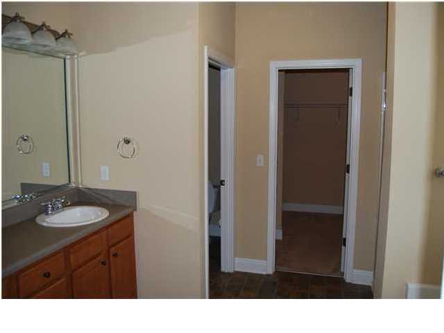 473 Lime Crestview, FL 32536 - Photo 12 of 16 a bathroom with a sink a mirror and a shower