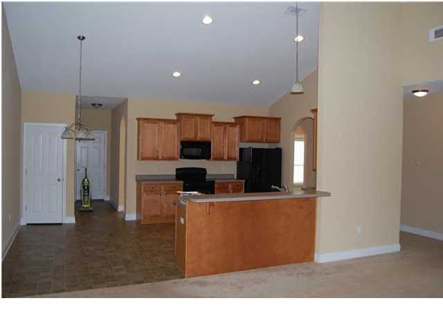 473 Lime Crestview, FL 32536 - Photo 3 of 16 a living room with stainless steel appliances kitchen island granite countertop a refrigerator a stove top oven a sink and a counter top