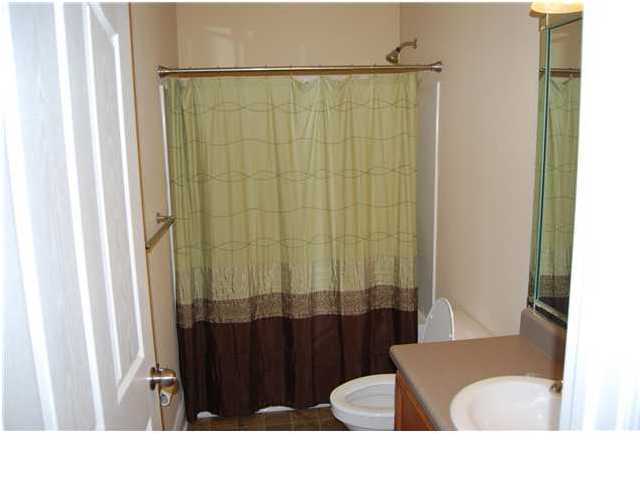 473 Lime Crestview, FL 32536 - Photo 6 of 16 a bathroom with a sink and a shower curtain