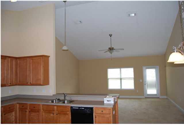 473 Lime Crestview, FL 32536 - Photo 8 of 16 a kitchen that has a sink and a stove with wooden floor