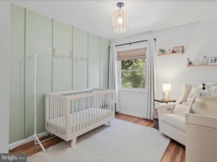 a view of a bedroom with furniture window and a chandelier