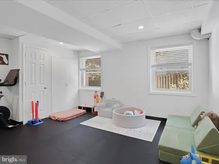 a room with gym equipment and a window