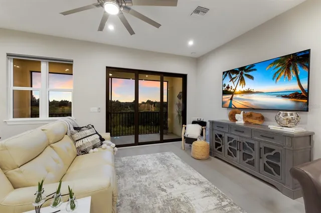 a view of living room with furniture and a flat screen tv