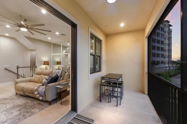 a view of a balcony with furniture